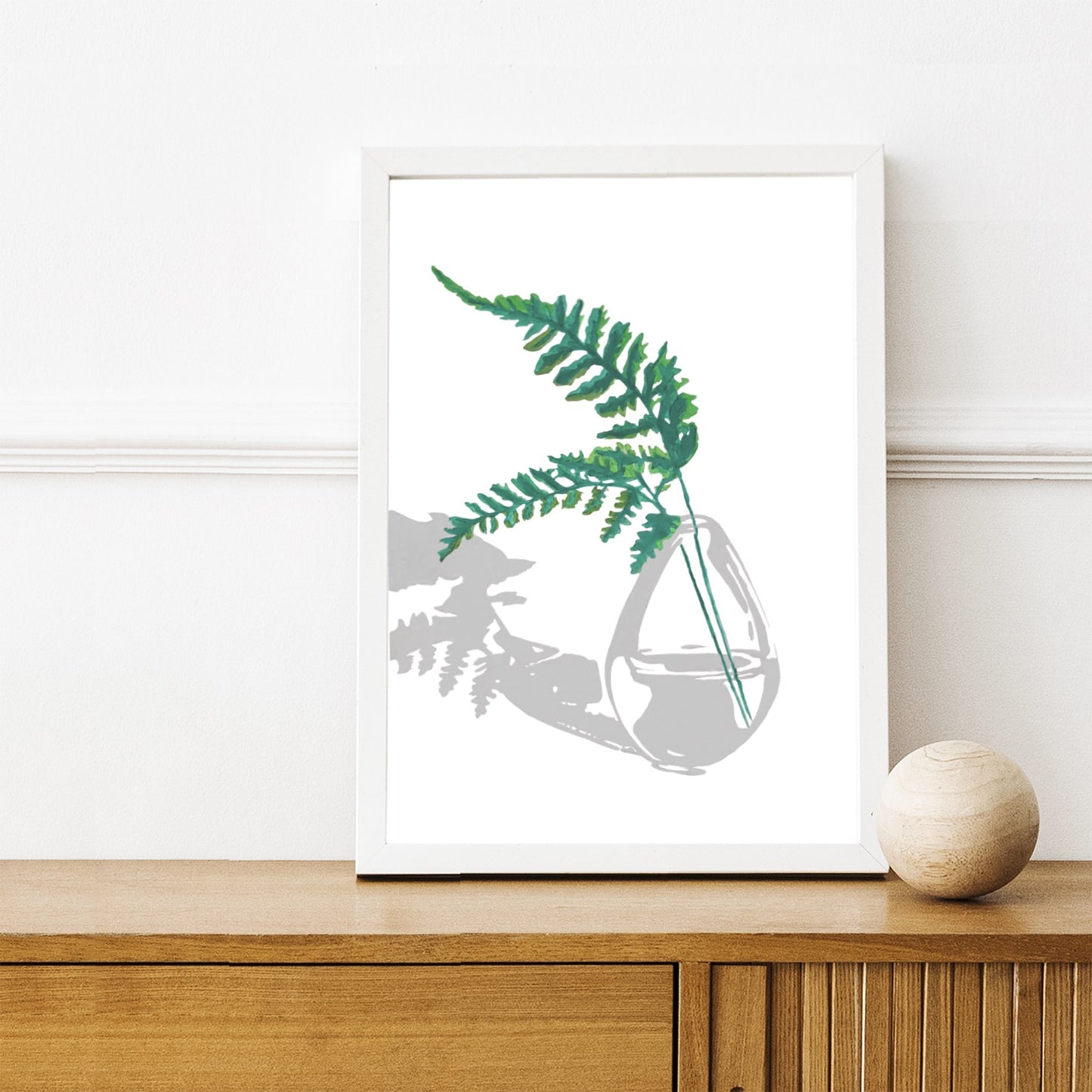 Minimalistic paint by number acrylic painting of green fern leaves in glass vase, framed in a black picture frame.